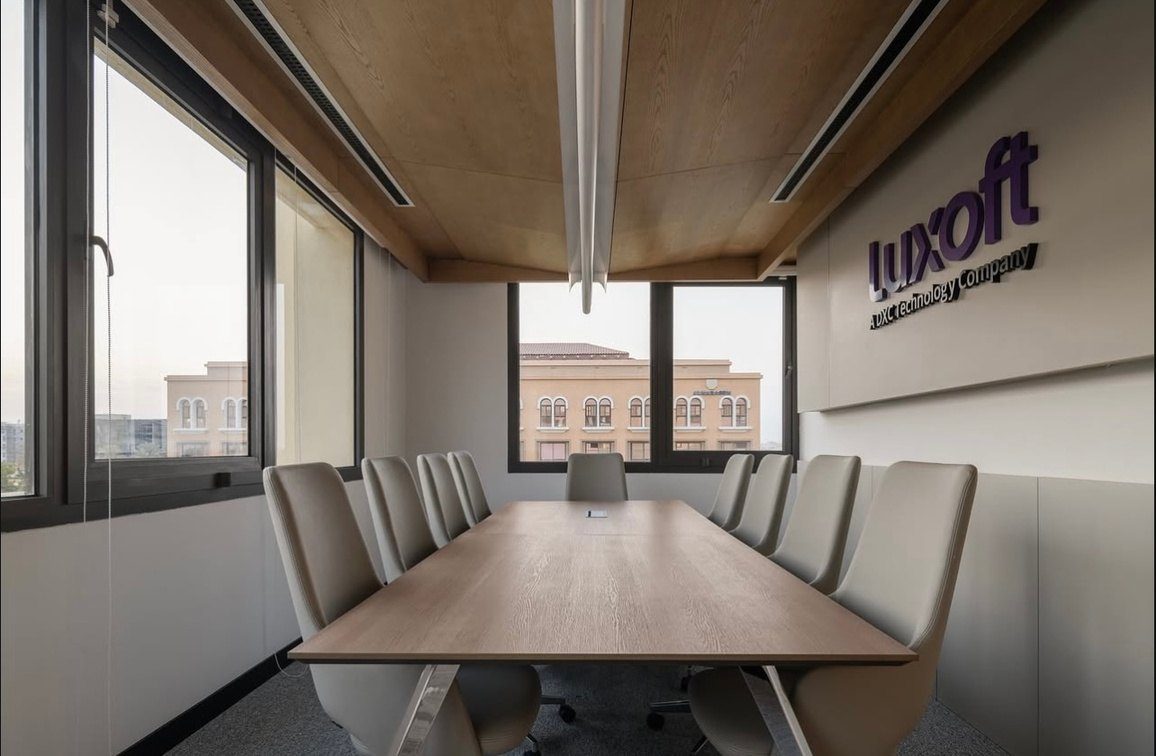 Meeting room with a timber table and slatted ceiling feature