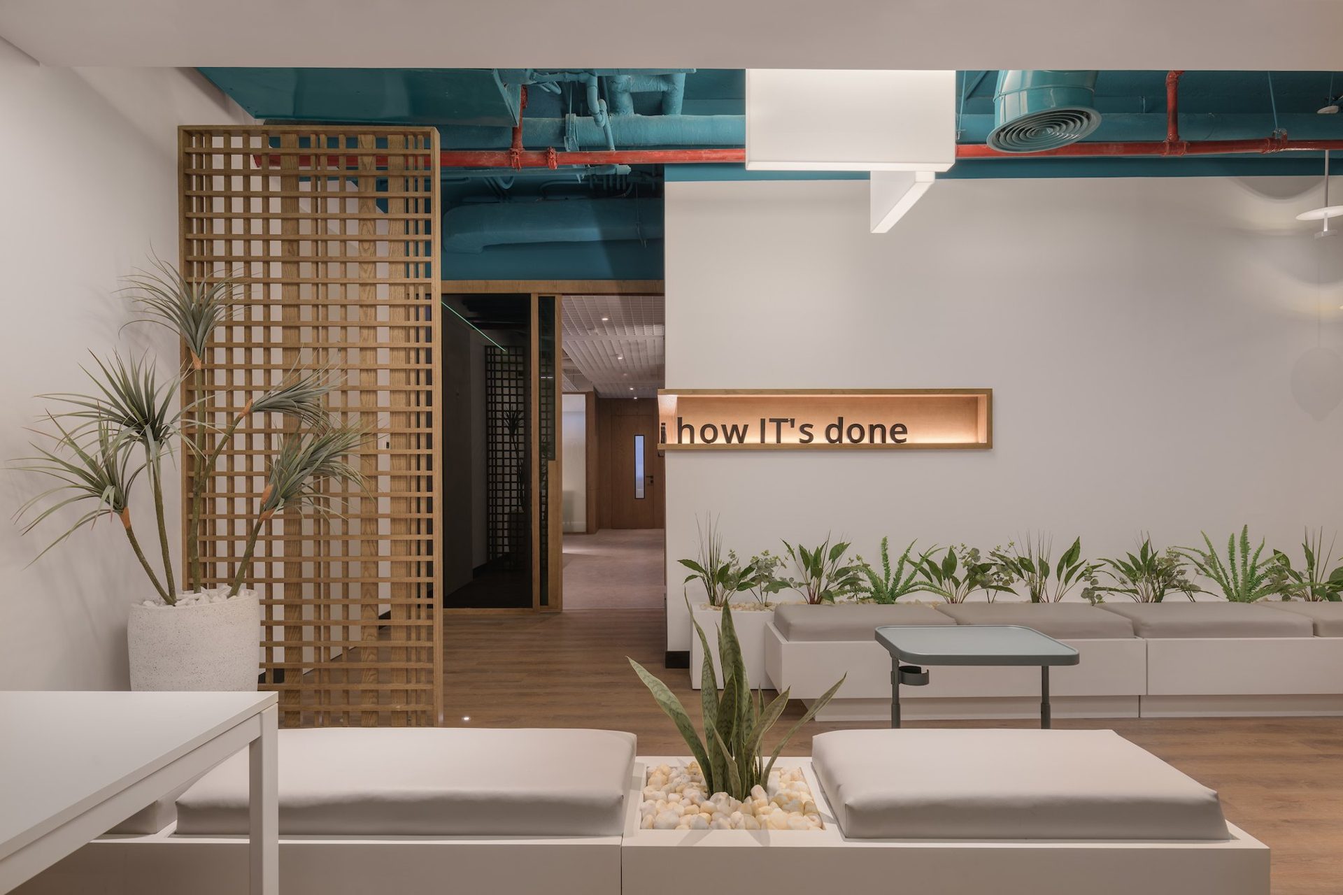 Lounge with a timber-slatted screen and planter