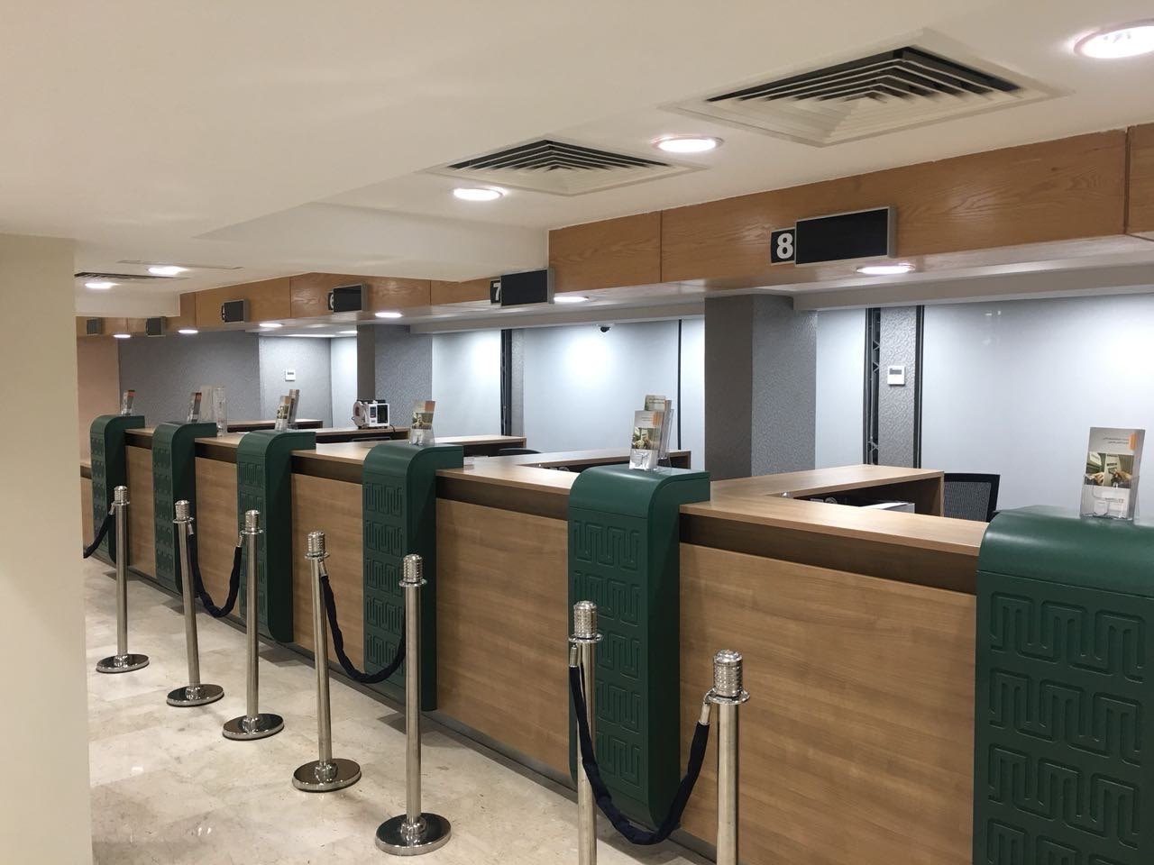 Bank hall with timber-faced teller counters